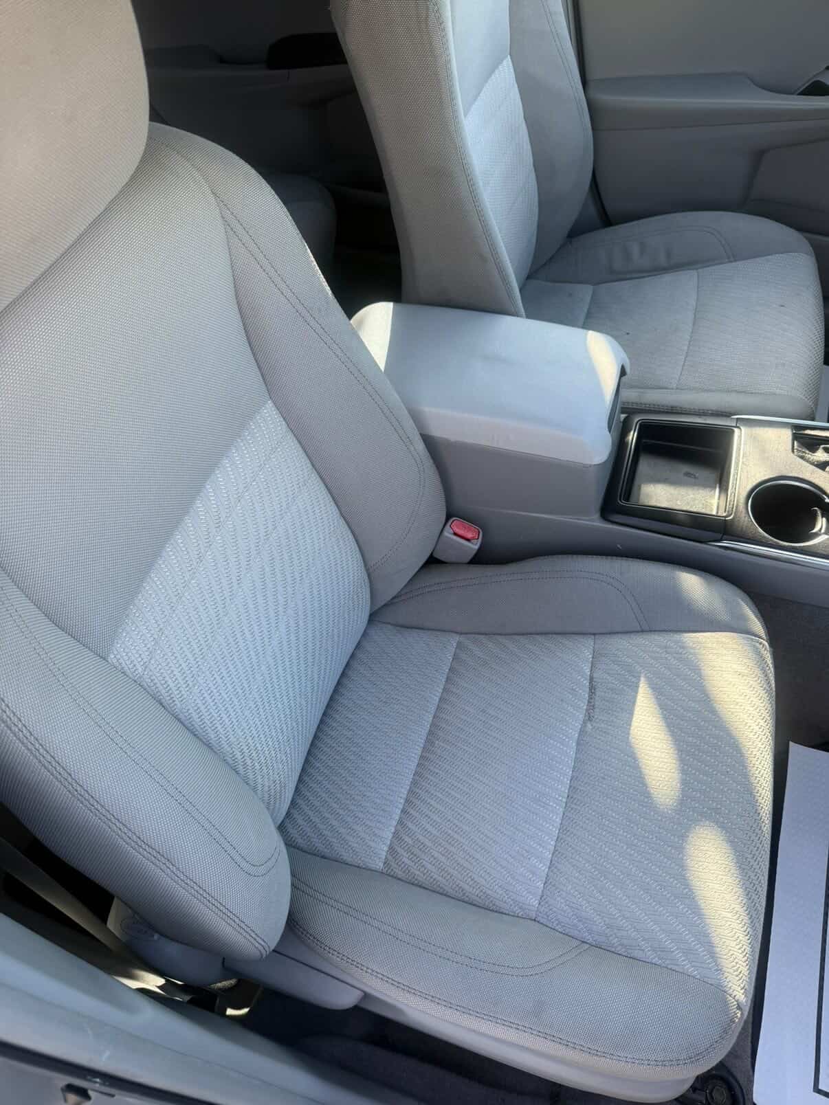 Refreshed gray cloth front seats after interior shampoo