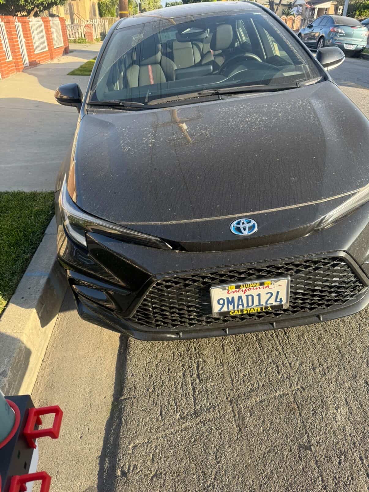 Black Toyota Corolla hybrid front view detailed