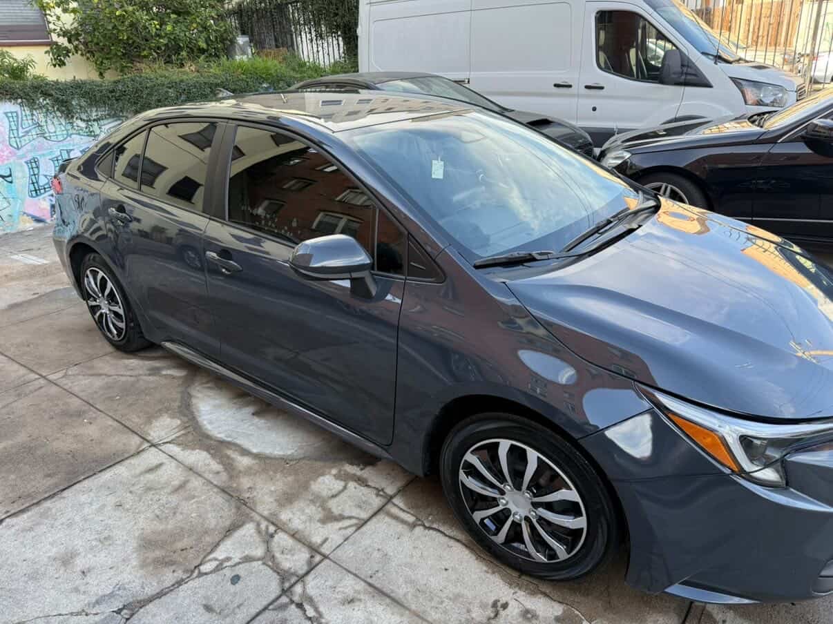 Gray Toyota Corolla detailed exterior in driveway