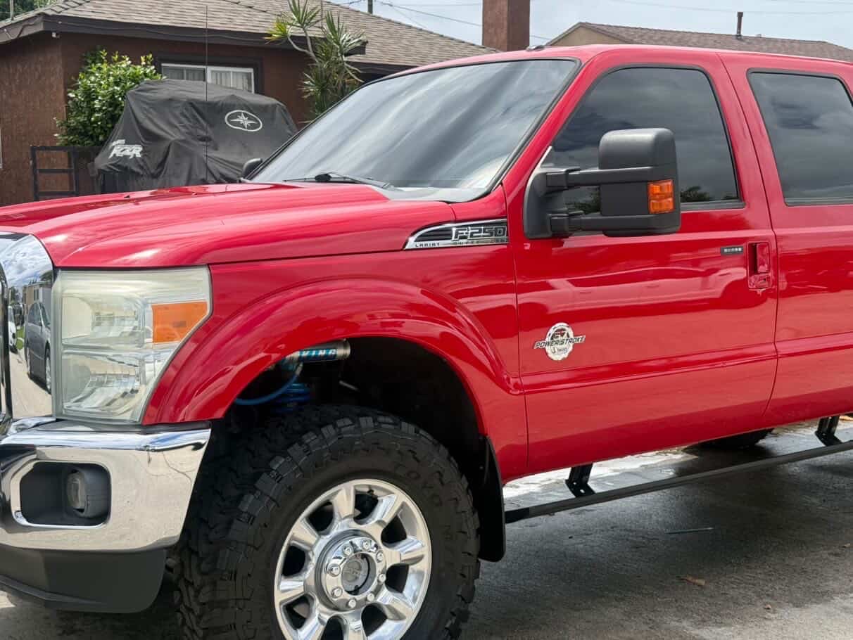 Lifted red Ford F-250 truck detailed by 213 Luis Mobile Detailing