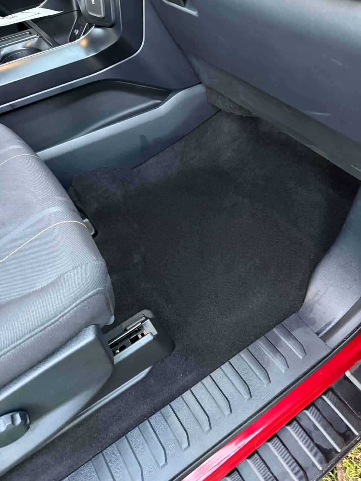 Spotless front passenger floor carpet after deep clean