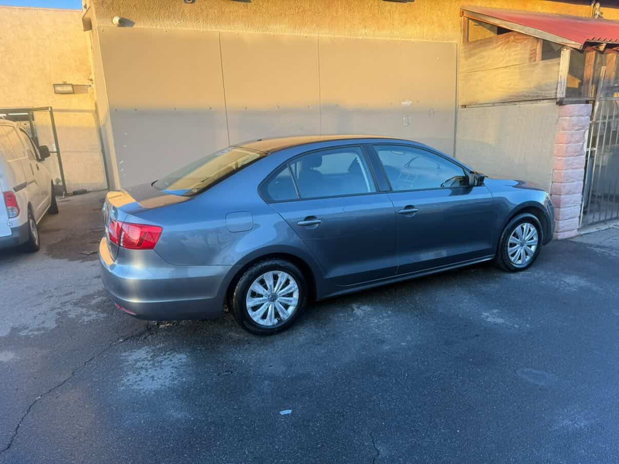 Gray Volkswagen Jetta detailed rear quarter view