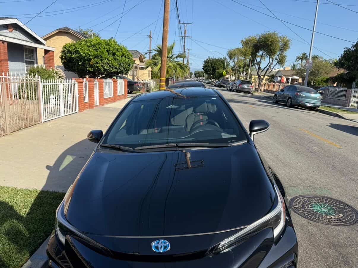 Black Toyota Prius hood and windshield detailed