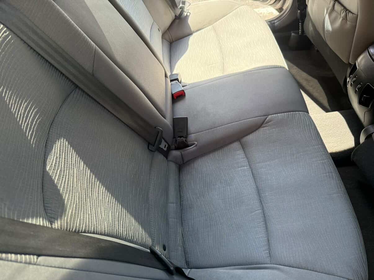 Cloth rear bench seats vacuumed and shampooed